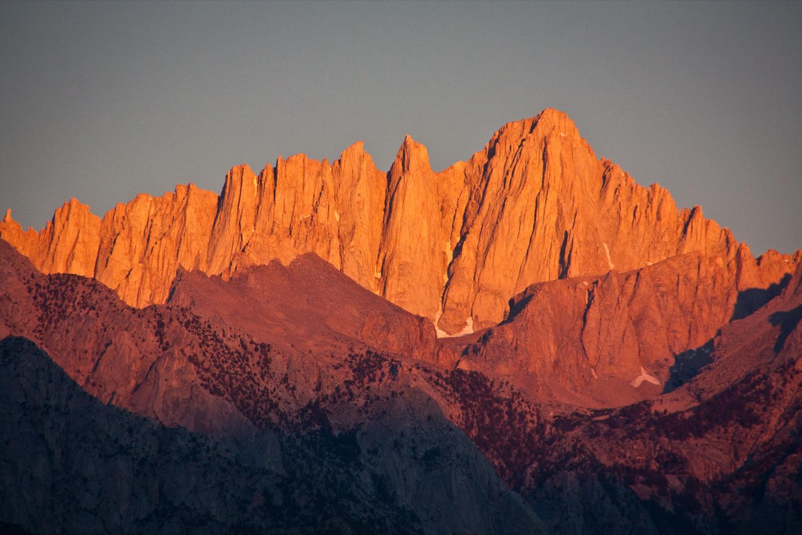 Mount Whitney glowing at sunrise above Lone Pine, California